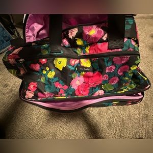 Like new! Used once as a carry on! Beautiful, bright, floral!